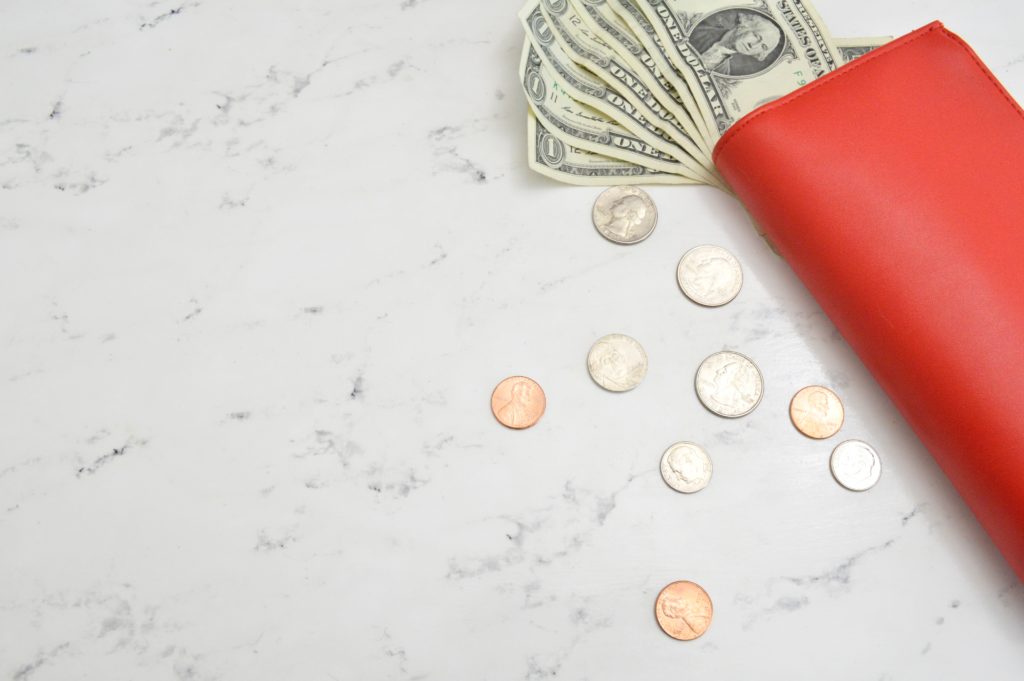 wallet with cash- frugal living tips for moms in 2020
